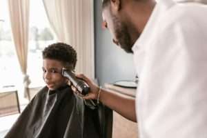 Close up of a man getting a hair cut