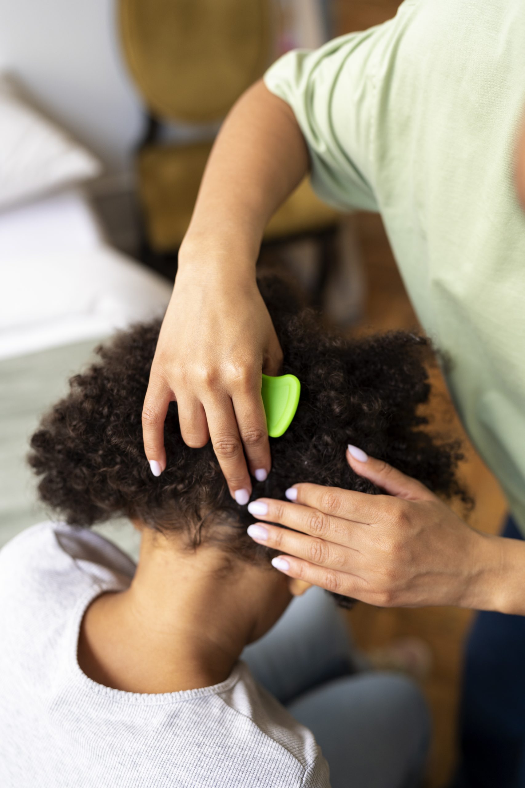 A black girl getting her natural hair treated