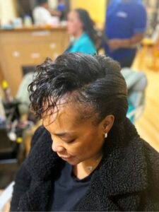 An african woman with styled natural hair