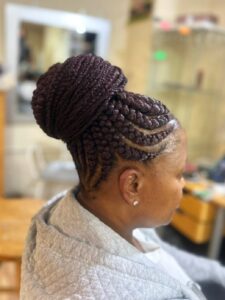 A black woman with jumbo braids hairstyle