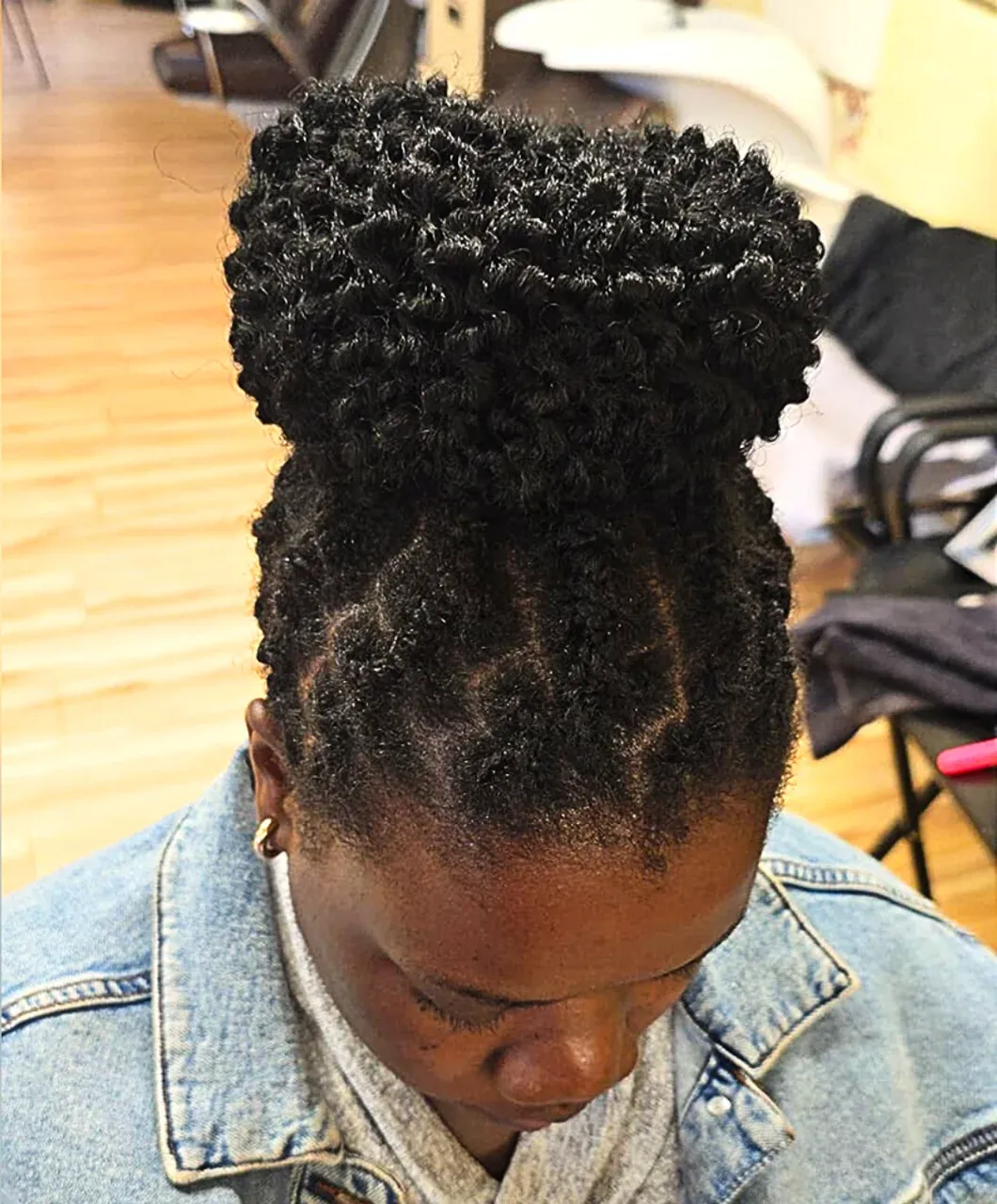 A woman with dreadlocks hairstyle at Tete Hazel salon