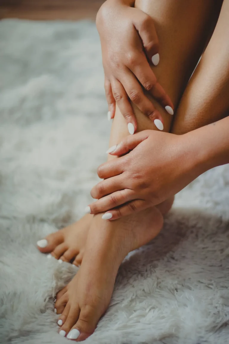 Close up of a woman's legs that have had a fresh pedicure