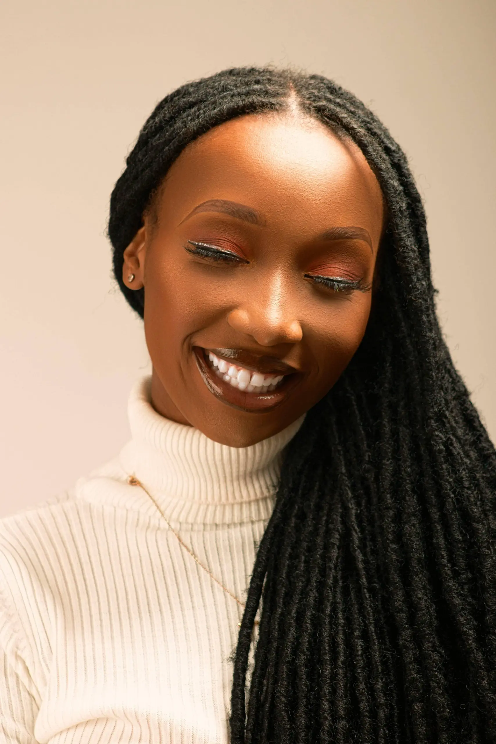 An African woman with freshly done dreadlocks